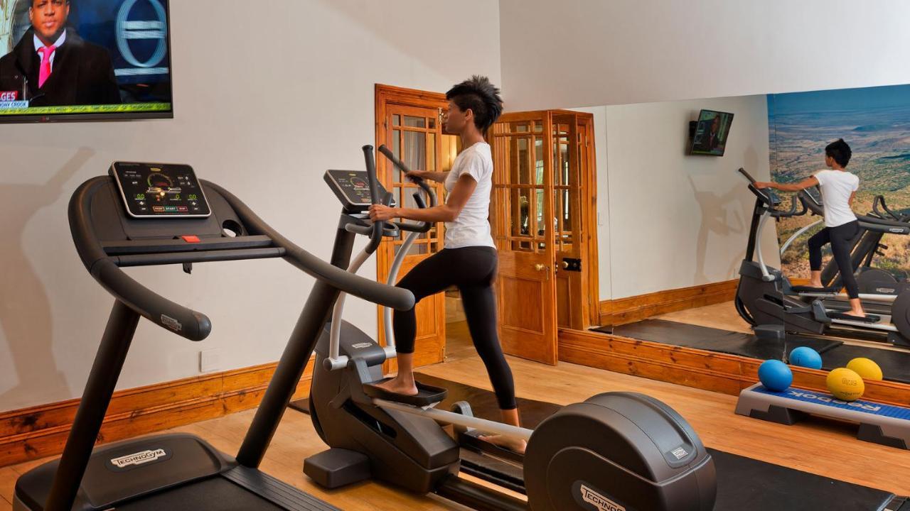 Drostdy Hotel Graaff-Reinet Kültér fotó A woman using a cross trainer